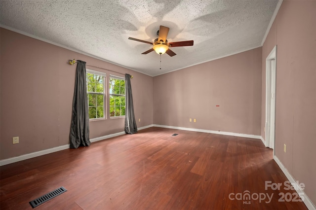 257 River Crest Dr, Flat Rock, NC 28731 - empty room featuring a ceiling fan, a textured ceiling, ornamental molding, visible vents, and wood finished floors