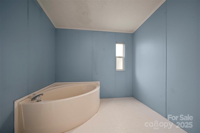 257 River Crest Dr, Flat Rock, NC 28731 - full bath featuring a textured ceiling, ornamental molding, and a bath