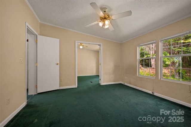 257 River Crest Dr, Flat Rock, NC 28731 - unfurnished room with a textured ceiling, crown molding, a ceiling fan, baseboards, and dark carpet