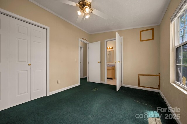 257 River Crest Dr, Flat Rock, NC 28731 - unfurnished bedroom with baseboards, dark carpet, and crown molding