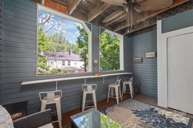 view of patio / terrace featuring ceiling fan and exterior bar