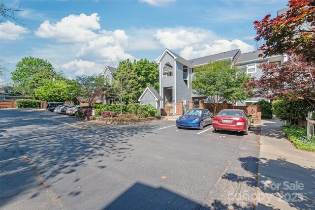 view of property with uncovered parking