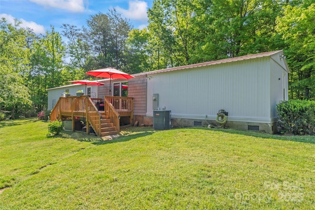 743 Dream Ln, Salisbury, NC 28146 - view of playground featuring a lawn, stairway, central air condition unit, and a wooden deck