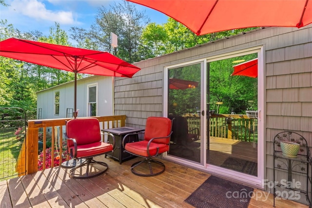 743 Dream Ln, Salisbury, NC 28146 - wooden terrace with outdoor dining area