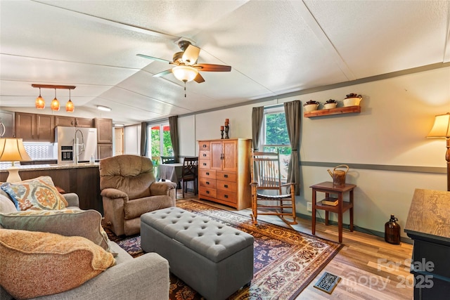 743 Dream Ln, Salisbury, NC 28146 - living area with a ceiling fan, a textured ceiling, visible vents, lofted ceiling, and light wood-style floors