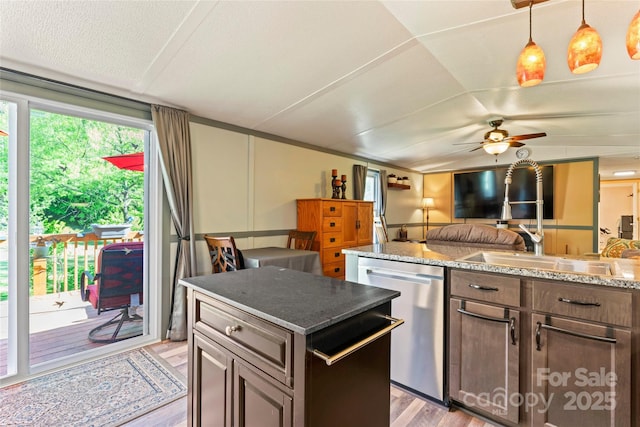 743 Dream Ln, Salisbury, NC 28146 - kitchen with ceiling fan, stainless steel dishwasher, a sink, light stone counters, and light wood-style floors