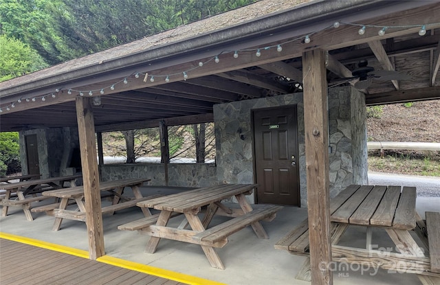 view of patio / terrace featuring a view of trees