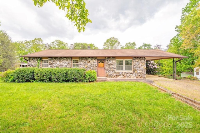 ranch-style home with stone siding, an attached carport, a front yard, and driveway