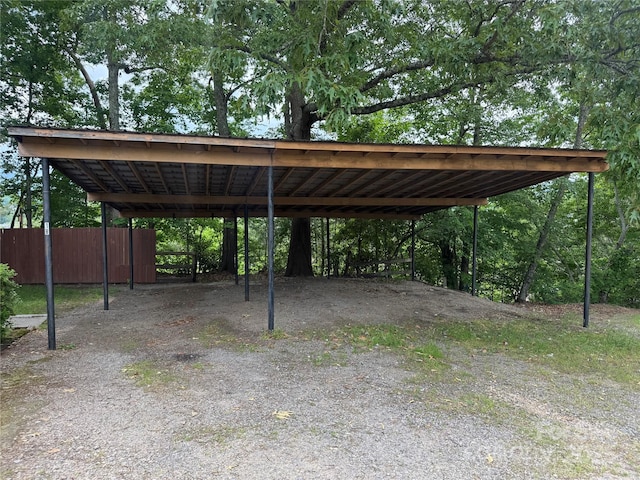 view of parking with a detached carport