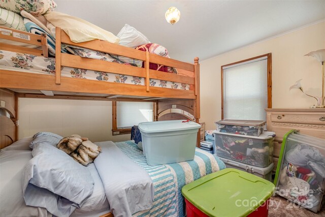 bedroom with ornamental molding