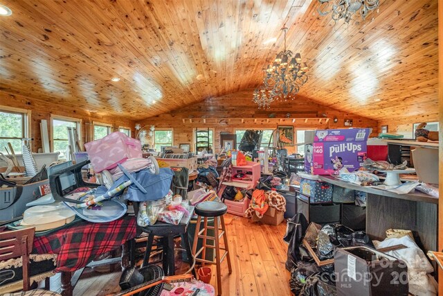 interior space with an inviting chandelier, wood ceiling, vaulted ceiling, and hardwood / wood-style flooring