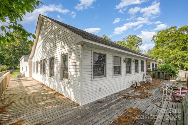 view of side of property featuring a deck