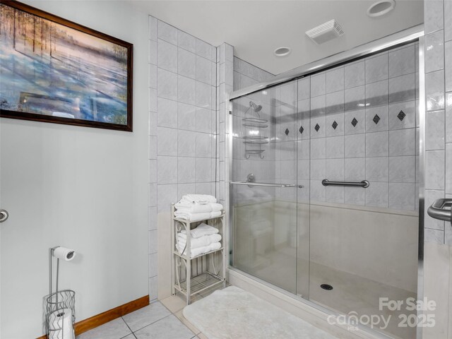 bathroom featuring tile patterned floors, recessed lighting, baseboards, visible vents, and a stall shower
