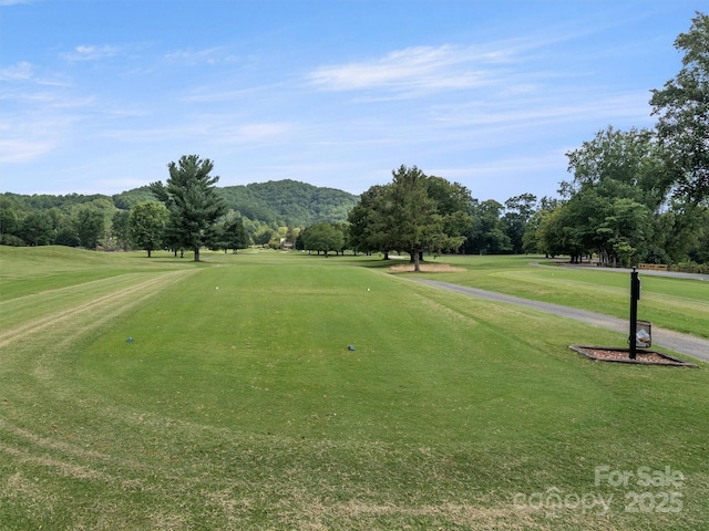 155 Quail Cove Rd Unit 1601, Lake Lure, NC 28746 - view of property's community with golf course view, a lawn, and view of wooded area