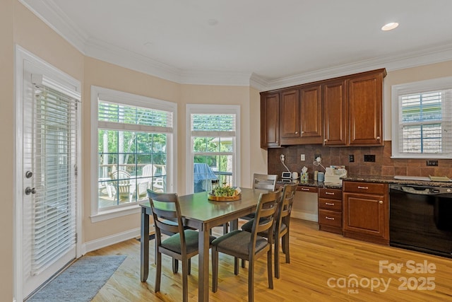 interior space featuring crown molding, tasteful backsplash, light wood-style floors, and dishwasher