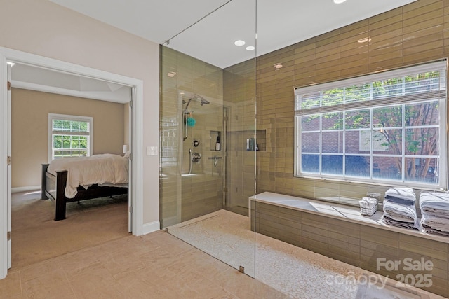 bathroom featuring recessed lighting, walk in shower, and ensuite bath