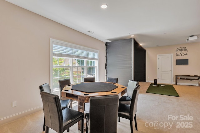 dining room featuring baseboards, recessed lighting, visible vents, and light carpet