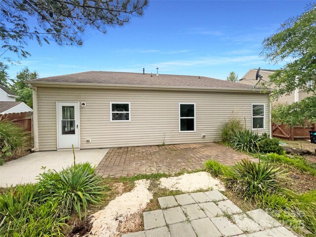 back of house featuring fence and a patio area