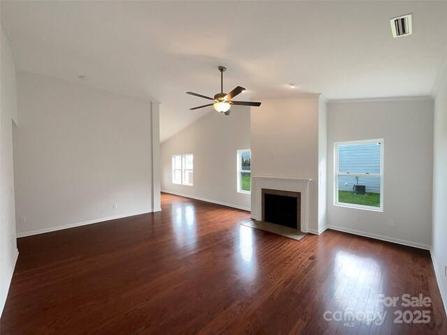 unfurnished living room with ceiling fan, baseboards, a fireplace with flush hearth, visible vents, and dark wood-style floors