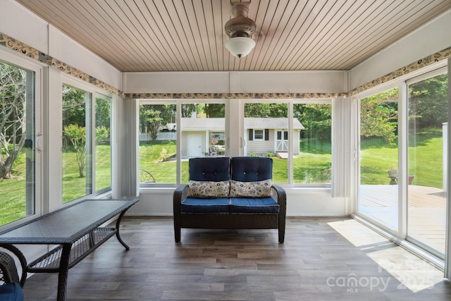sunroom with a ceiling fan and a wealth of natural light