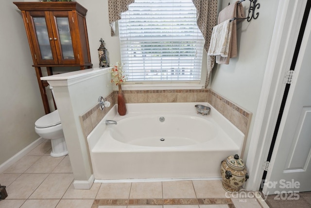 bathroom featuring toilet, tile patterned flooring, and a garden tub
