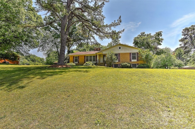 385 Gum Branch Rd, Charlotte, NC 28214 - ranch-style house featuring a chimney and a front lawn