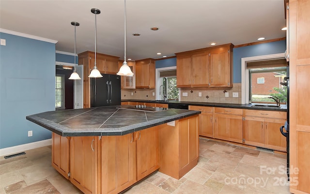 385 Gum Branch Rd, Charlotte, NC 28214 - kitchen with visible vents, ornamental molding, black appliances, and a breakfast bar