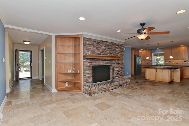 385 Gum Branch Rd, Charlotte, NC 28214 - unfurnished living room with baseboards, ornamental molding, a wealth of natural light, and stone tile flooring