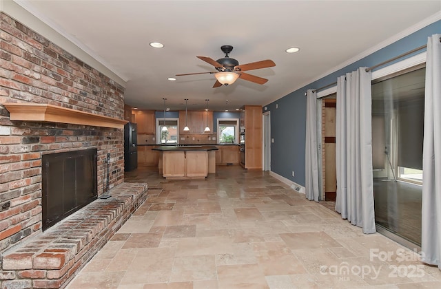 385 Gum Branch Rd, Charlotte, NC 28214 - unfurnished living room with stone tile flooring, a fireplace, baseboards, ceiling fan, and recessed lighting