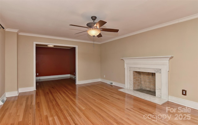 385 Gum Branch Rd, Charlotte, NC 28214 - unfurnished living room featuring crown molding, ceiling fan, baseboards, and light wood-type flooring