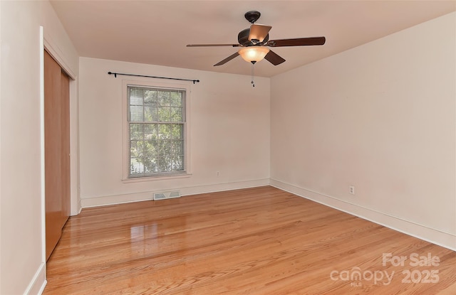 385 Gum Branch Rd, Charlotte, NC 28214 - spare room with visible vents, a ceiling fan, light wood finished floors, and baseboards