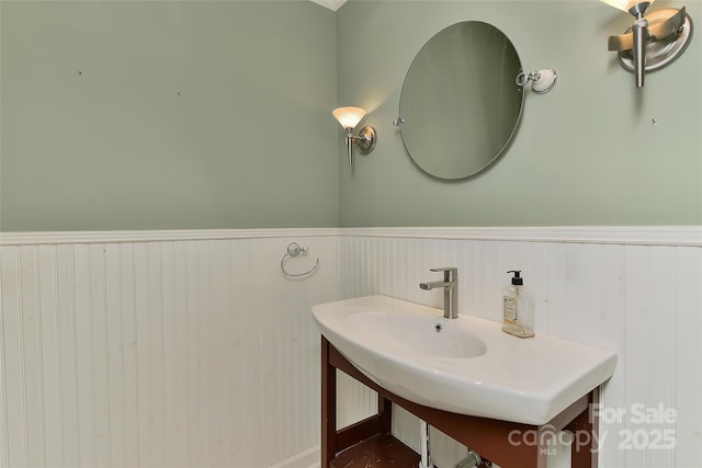 385 Gum Branch Rd, Charlotte, NC 28214 - bathroom with a sink and wainscoting