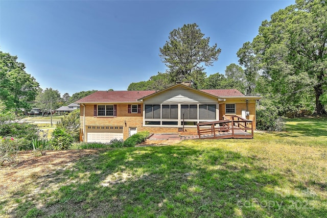 385 Gum Branch Rd, Charlotte, NC 28214 - rear view of property featuring a garage, a yard, a sunroom, and brick siding