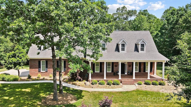 4570 Chanel Ct, Concord, NC 28025 - cape cod home with brick siding, covered porch, and a front lawn