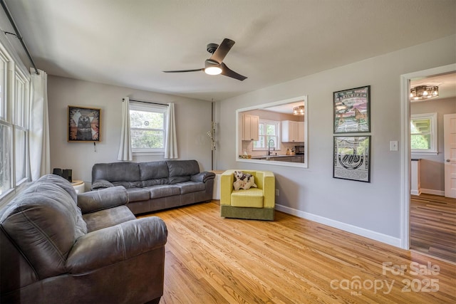 111 Baxter St, Morganton, NC 28655 - living area with baseboards, a ceiling fan, and wood finished floors
