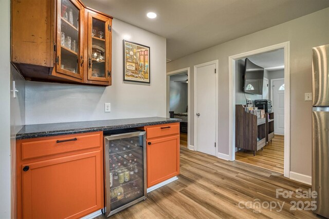 111 Baxter St, Morganton, NC 28655 - bar featuring freestanding refrigerator, beverage cooler, light wood-style floors, baseboards, and a dry bar