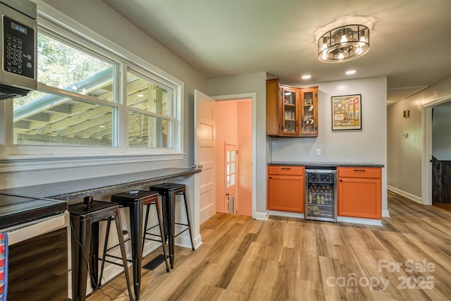 111 Baxter St, Morganton, NC 28655 - bar with a dry bar, recessed lighting, baseboards, light wood-type flooring, and wine cooler