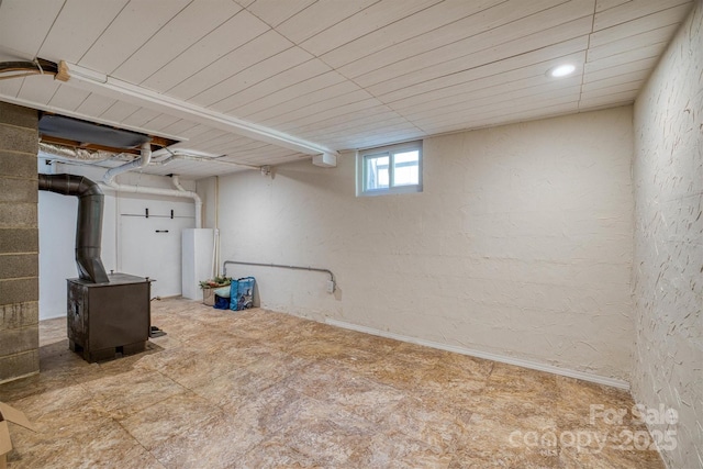 111 Baxter St, Morganton, NC 28655 - basement with a textured wall and a wood stove