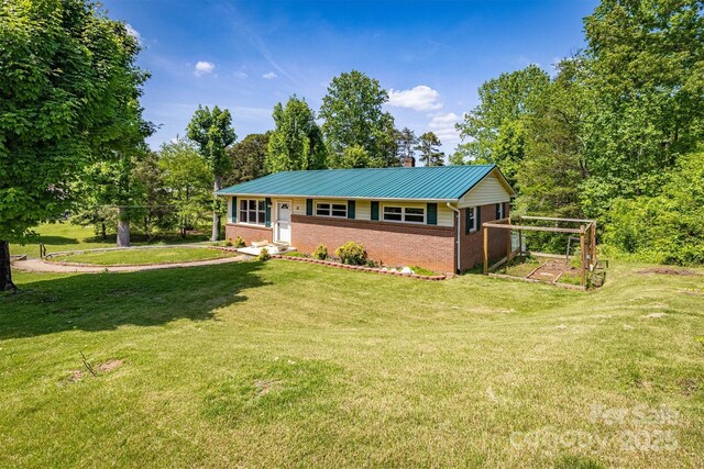 111 Baxter St, Morganton, NC 28655 - ranch-style house with brick siding, a chimney, a front yard, and metal roof