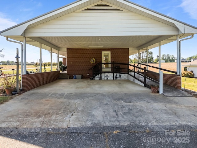 view of car parking featuring a carport and concrete driveway