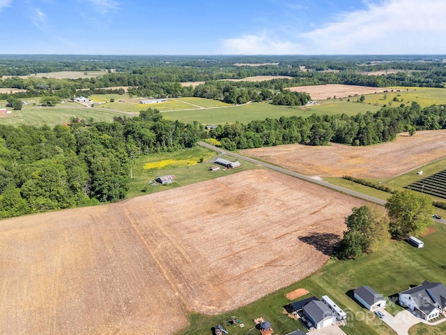 birds eye view of property featuring a rural view