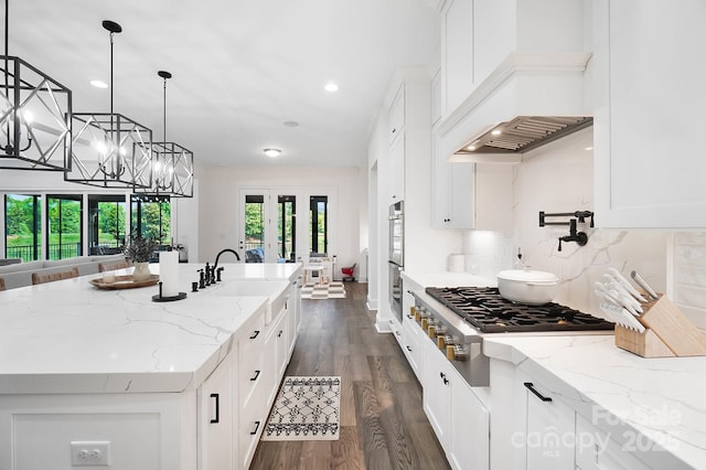 1005 Grand Oak Dr, Waxhaw, NC 28173 - kitchen with stainless steel appliances, custom exhaust hood, a sink, a center island with sink, and white cabinets