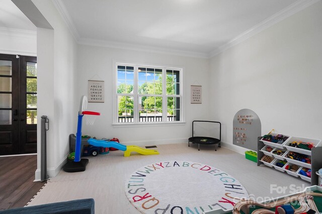 1005 Grand Oak Dr, Waxhaw, NC 28173 - rec room featuring baseboards, ornamental molding, and carpet flooring