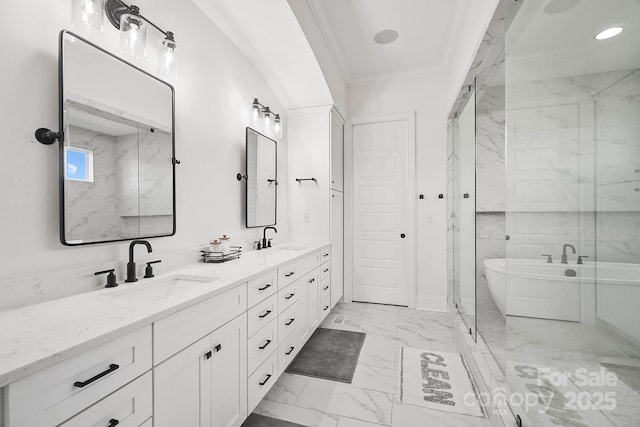 1005 Grand Oak Dr, Waxhaw, NC 28173 - full bathroom featuring marble look tile flooring, a freestanding bath, a marble finish shower, double vanity, and ornamental molding