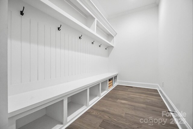1005 Grand Oak Dr, Waxhaw, NC 28173 - mudroom featuring ornamental molding, dark wood finished floors, and baseboards