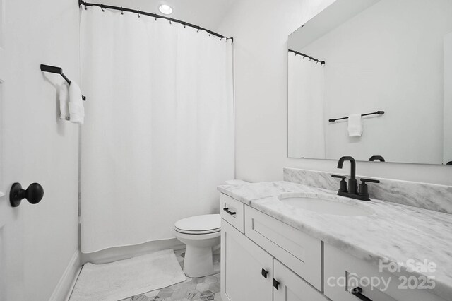 1005 Grand Oak Dr, Waxhaw, NC 28173 - bathroom featuring marble finish flooring, vanity, toilet, and a shower with curtain