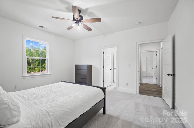 1005 Grand Oak Dr, Waxhaw, NC 28173 - carpeted bedroom featuring baseboards and ceiling fan