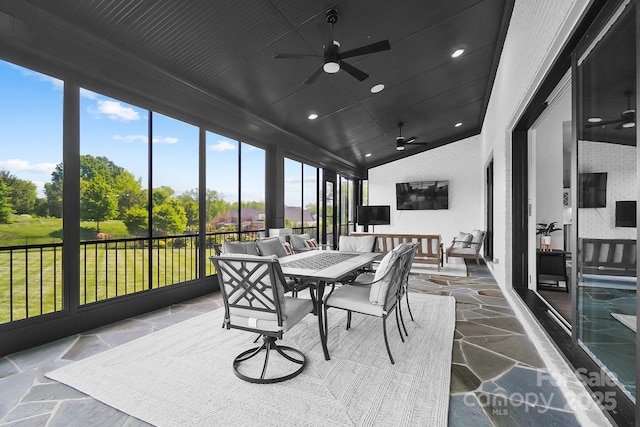 1005 Grand Oak Dr, Waxhaw, NC 28173 - sunroom / solarium with ceiling fan, lofted ceiling, stone flooring, outdoor dining space, and recessed lighting
