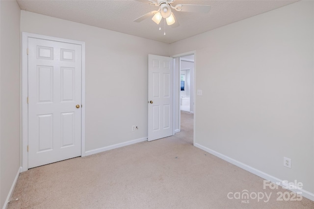 16017 Woodcote Dr, Huntersville, NC 28078 - unfurnished bedroom with carpet, baseboards, and ceiling fan