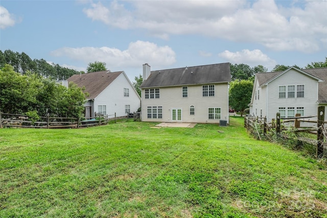 16017 Woodcote Dr, Huntersville, NC 28078 - rear view of house with a patio and a chimney